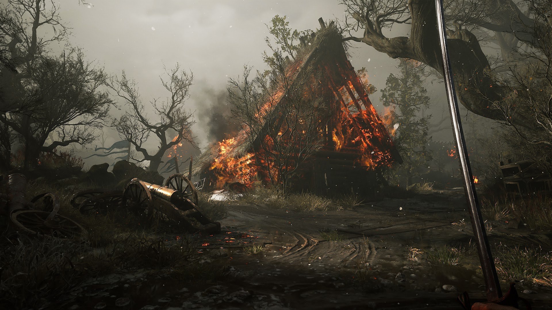 Valor Mortis — A burning building beside a woodland path.